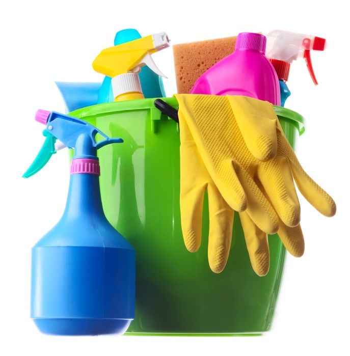 Cleaning supplies in a green bucket